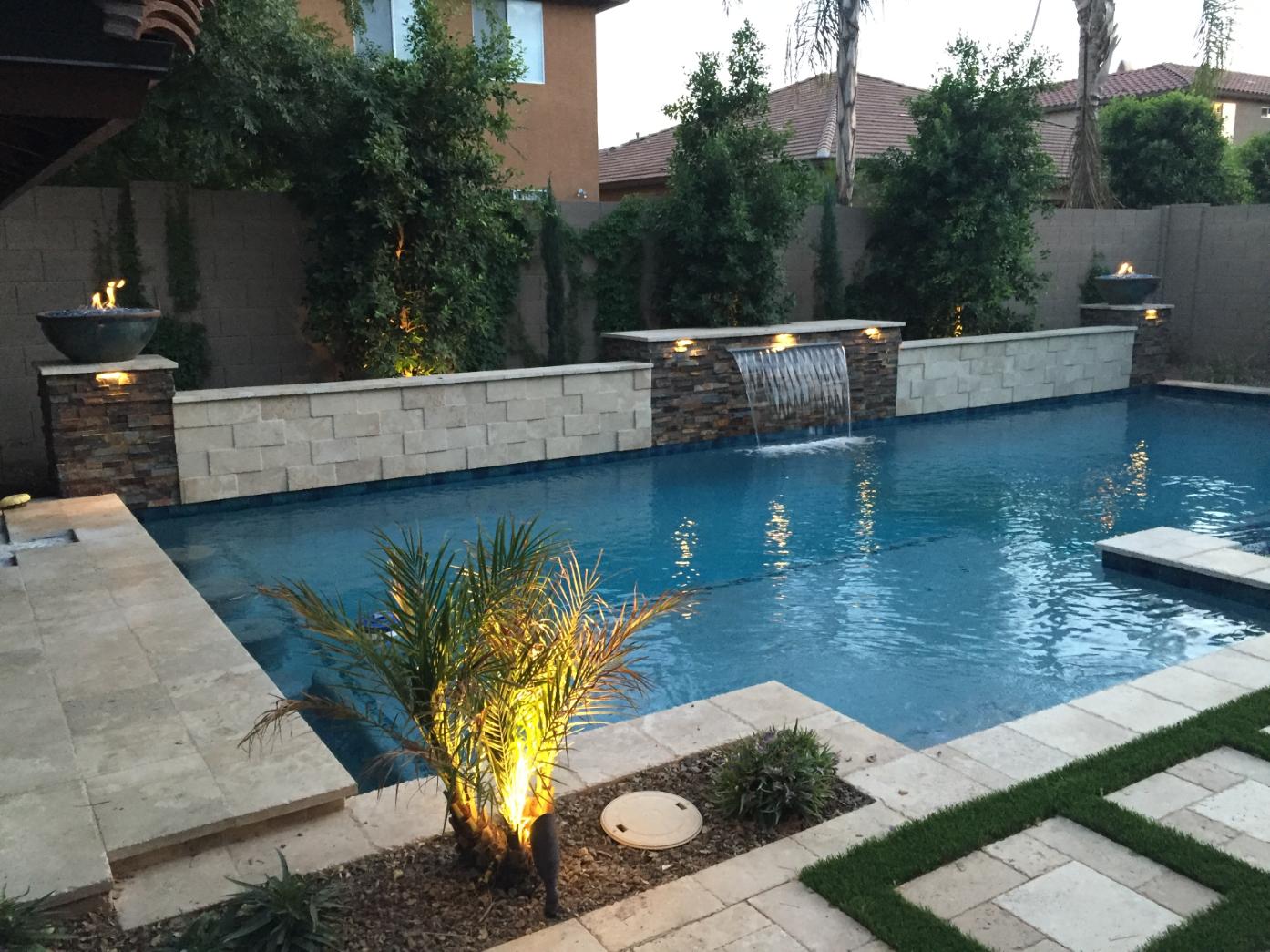 Integrated patio design with pool and surrounding garden elements